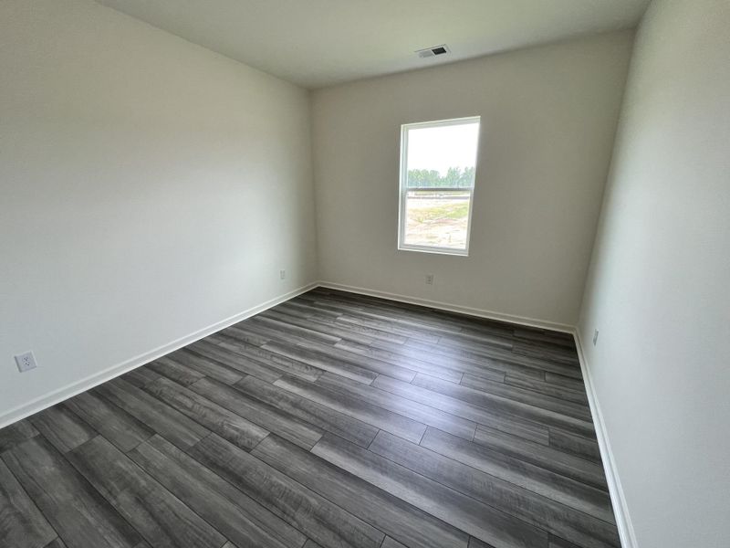 Spacious, unfurnished interior of a new home in Crossing at Givhans, Ridgeville (Image 6).
