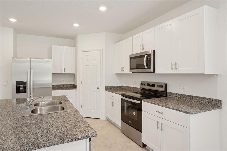 Furnished interior view inside a new home in Lake Deer Estates - Signature Series, Poinciana (Image 7). Furnished interior view inside a new home in Lake Deer Estates - Signature Series, Poinciana (Image 7).