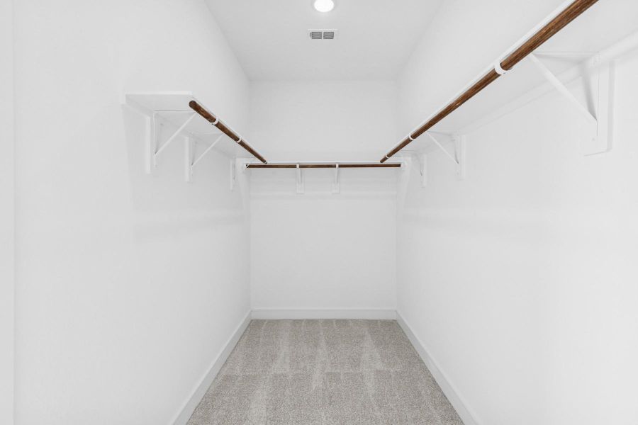 Primary walk-in closet (*Photo not of actual home and used for illustration purposes only.)