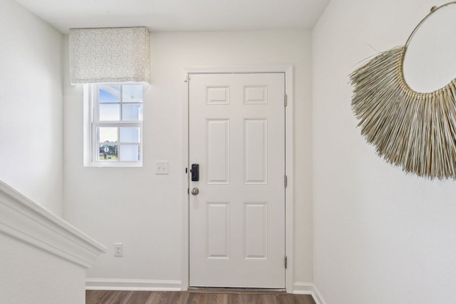 A white door in a room. A white door in a room.