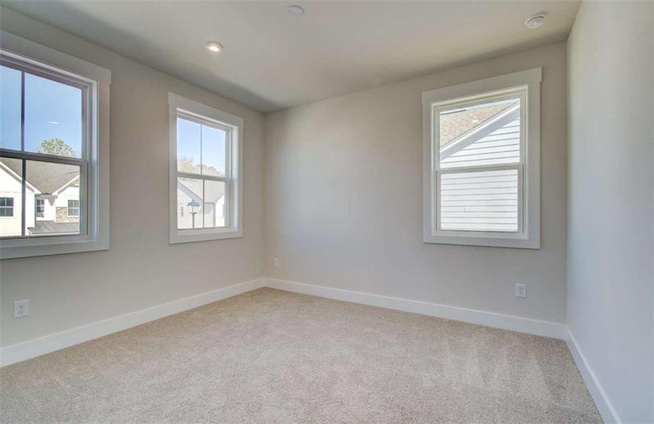 Spacious, unfurnished interior of a new home in The Paddocks at Doc Hughes, Buford (Image 40).