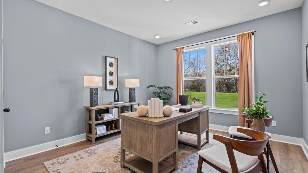 Functional secondary bedrooms with hardwood flooring and modern touches in an exceptional layout