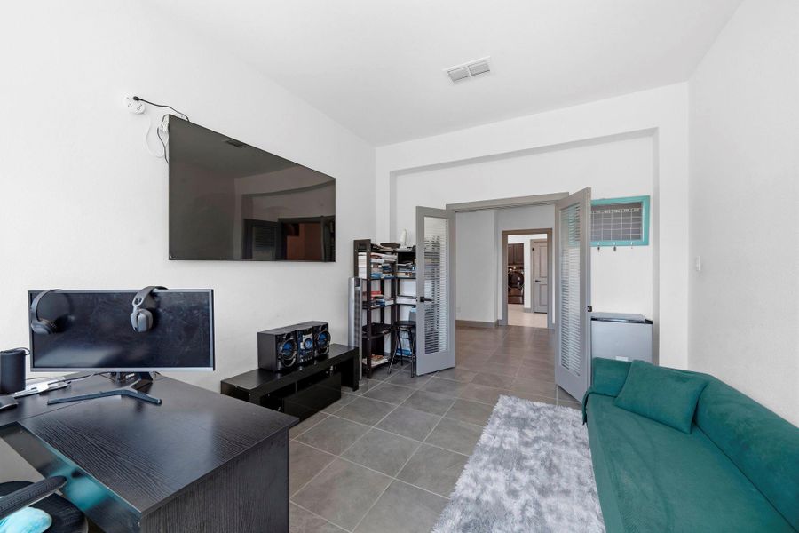 Private home office with large windows for natural light and flexible layout—ideal for remote work, study, or creative space.