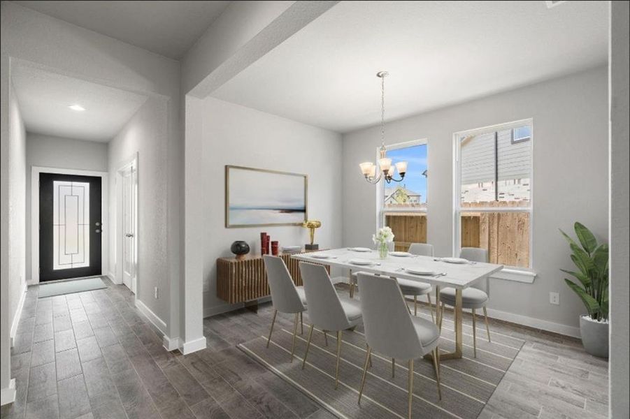 Create cherished moments with loved ones in this expansive dining room, boasting elegant flooring, custom paint, and seamless flow to the family room and kitchen. Sample photo, virtually staged.