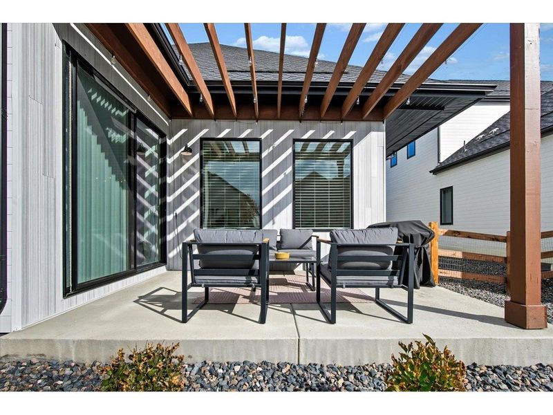 Exterior details and patio area of a home in Pelican Shores at Water Valley, Windsor (Image 3).