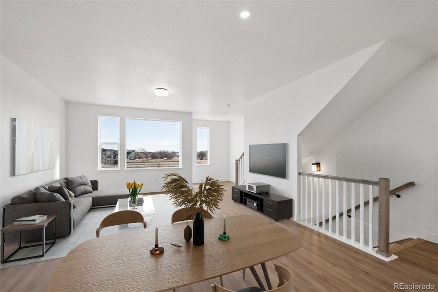 Light filled open concept main level. Virtually staged.