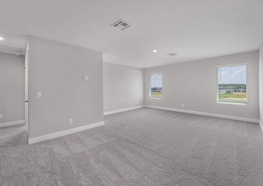 This home is highlighted by a large upstairs game room.