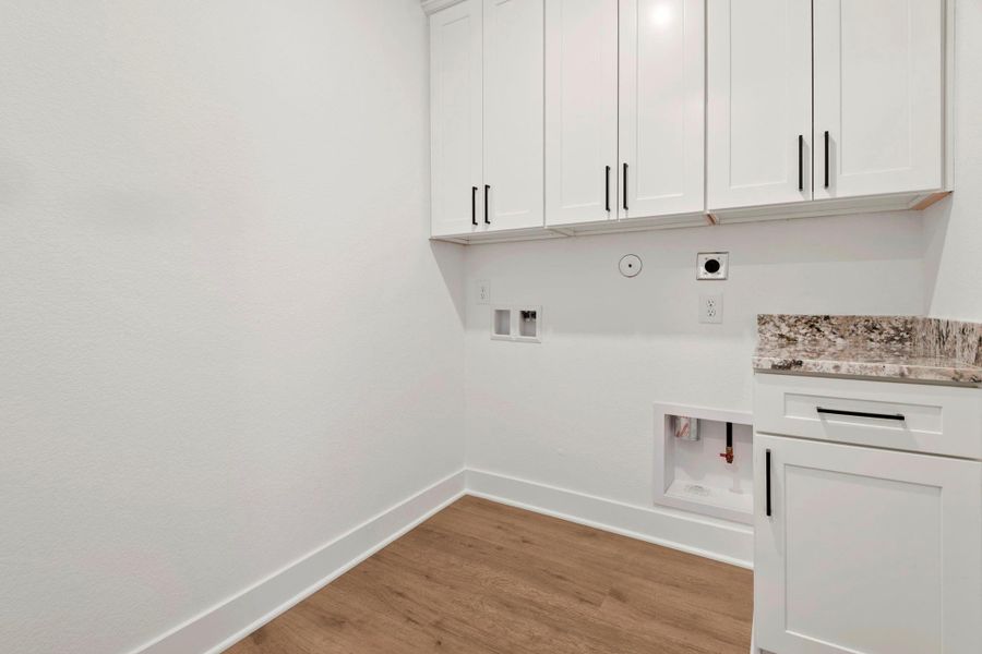Additional cabinet space in the laundry room.