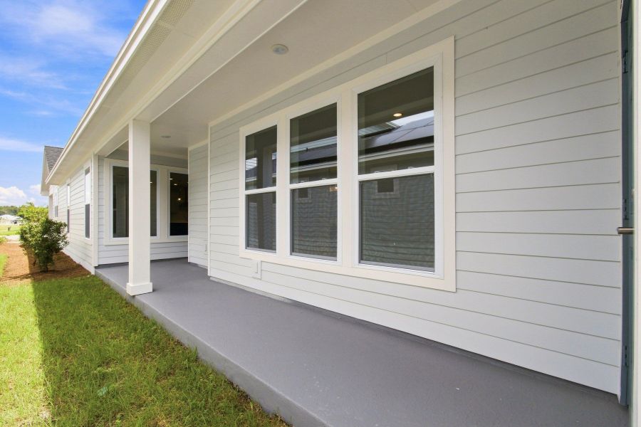 Exterior details and patio area of a home in Weslyn Park in Sunbridge 34', St. Cloud (Image 3). Exterior details and patio area of a home in Weslyn Park in Sunbridge 34', St. Cloud (Image 3).