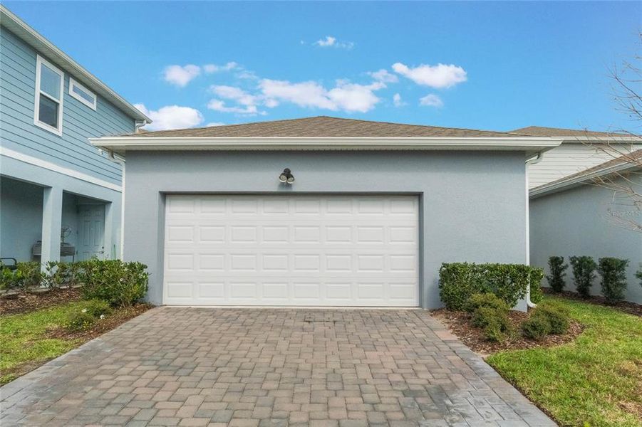 Front exterior of a new home in Isles of Lake Nona, Orlando, FL, highlighting curb appeal (Image 24).