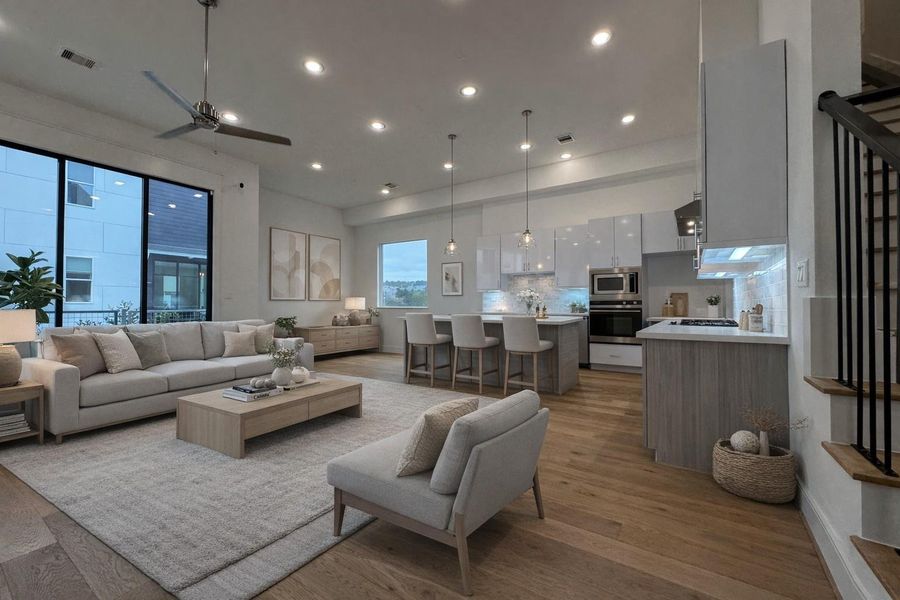 First floor living and dining area featuring an elegant 10' tall sliding glass door.   Virtual staging added.