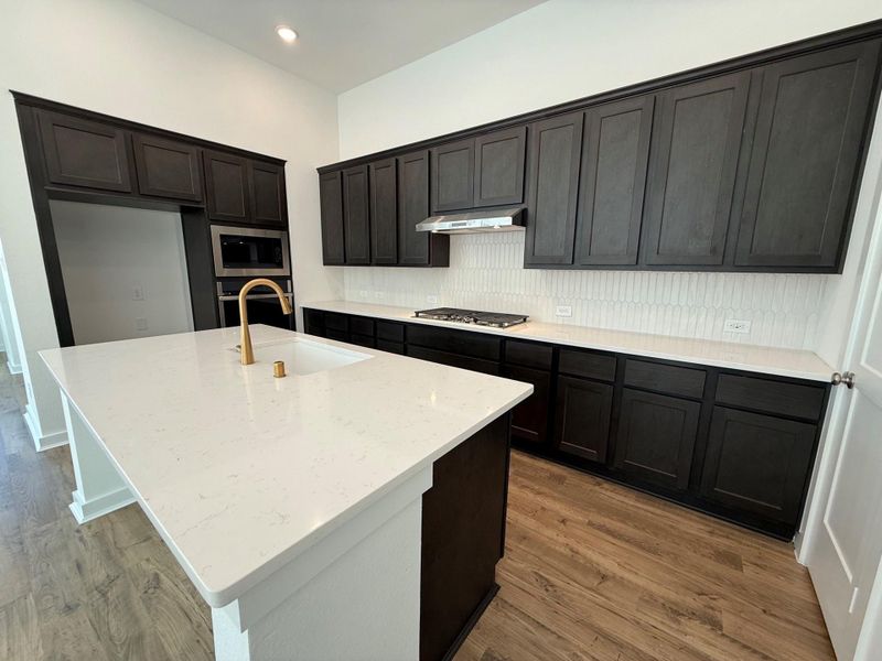 Kitchen with updated backsplash