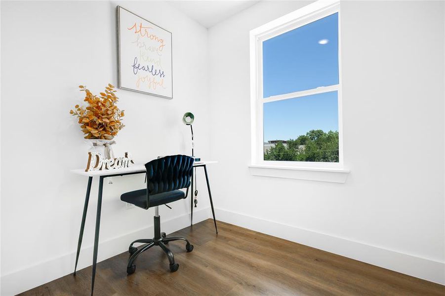 Office with dark hardwood / wood-style floors