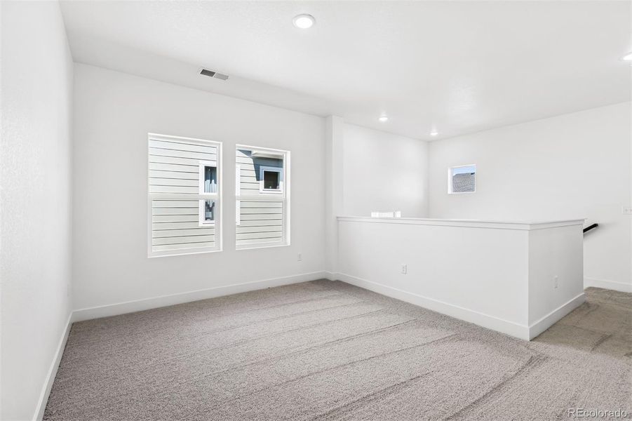 Spacious, unfurnished interior of a new home in Painted Prairie Cottage, Aurora (Image 27).