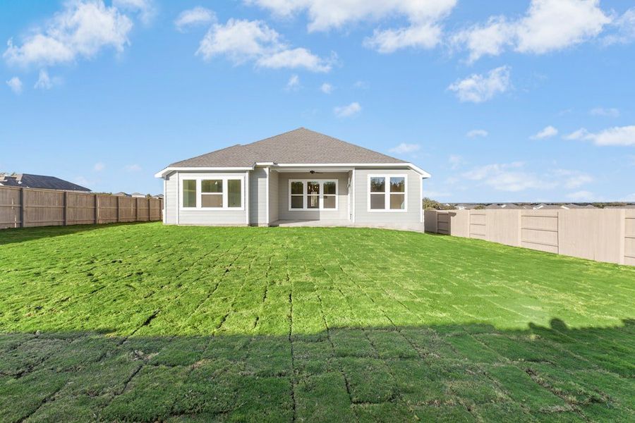 Exterior details and patio area of a home in The Colony, Bastrop (Image 22).