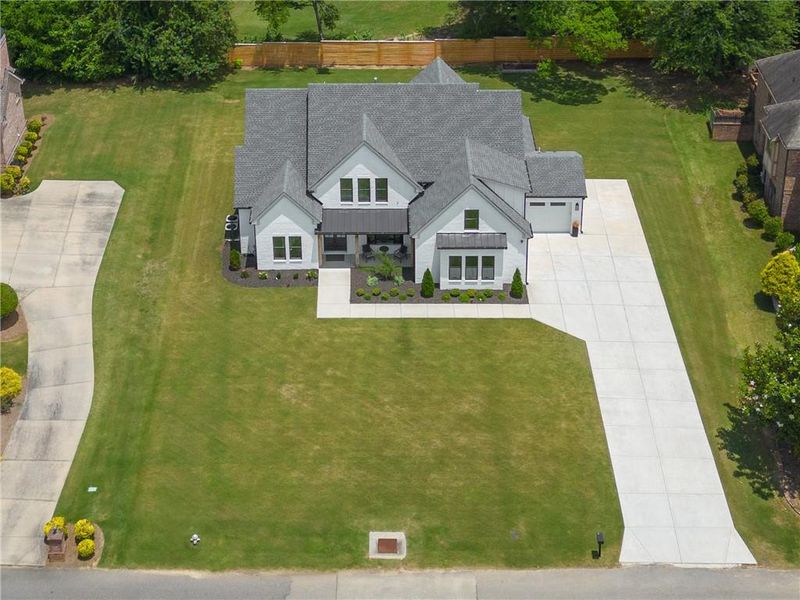 Front exterior of a new home in , Dacula, GA, highlighting curb appeal (Image 21).