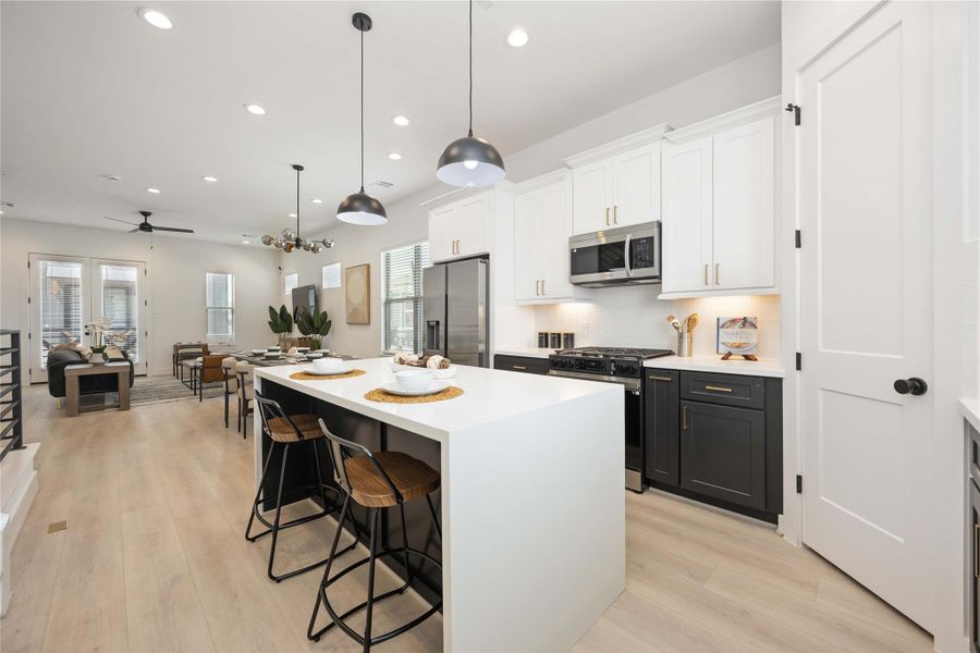 Island kitchen. Photo of the model home. Finishes & specifications may vary.