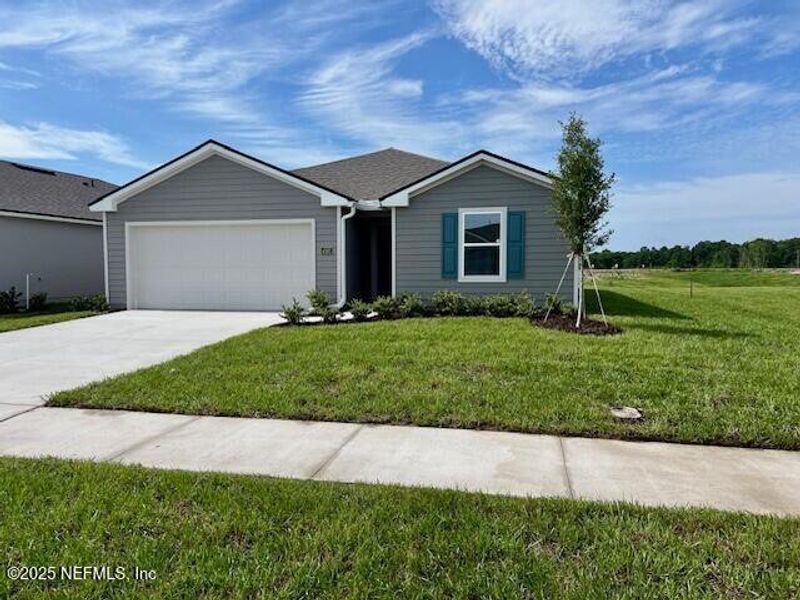 Front exterior of a new home in Rookery, Green Cove Springs, FL, highlighting curb appeal (Image 12). Front exterior of a new home in Rookery, Green Cove Springs, FL, highlighting curb appeal (Image 12).