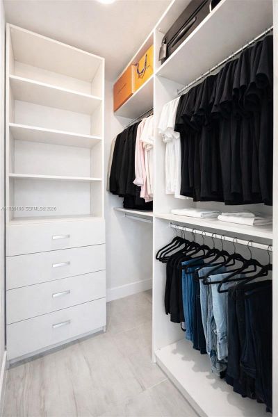 Custom-designed closet maximizing storage and organization Custom-designed closet maximizing storage and organization