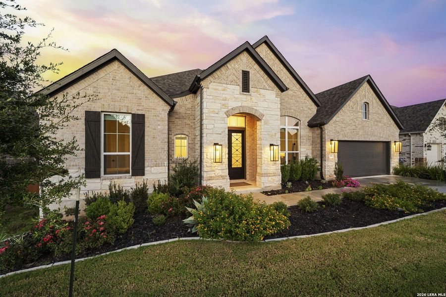 Front exterior of a new home in La Cima, San Marcos, TX, highlighting curb appeal (Image 21).