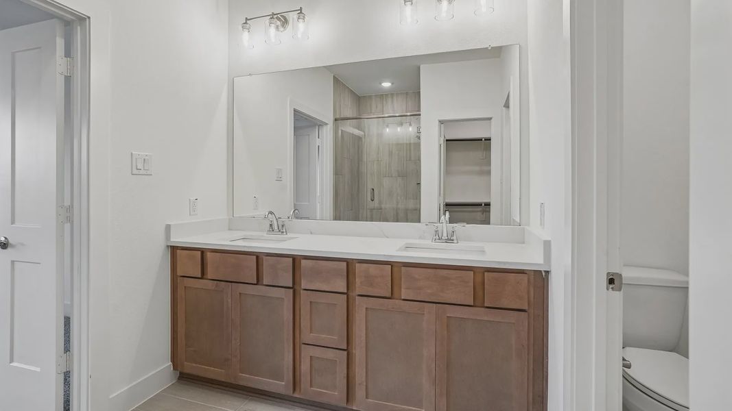 Furnished interior view inside a new home in Meridiana Townhomes, Iowa Colony (Image 9).