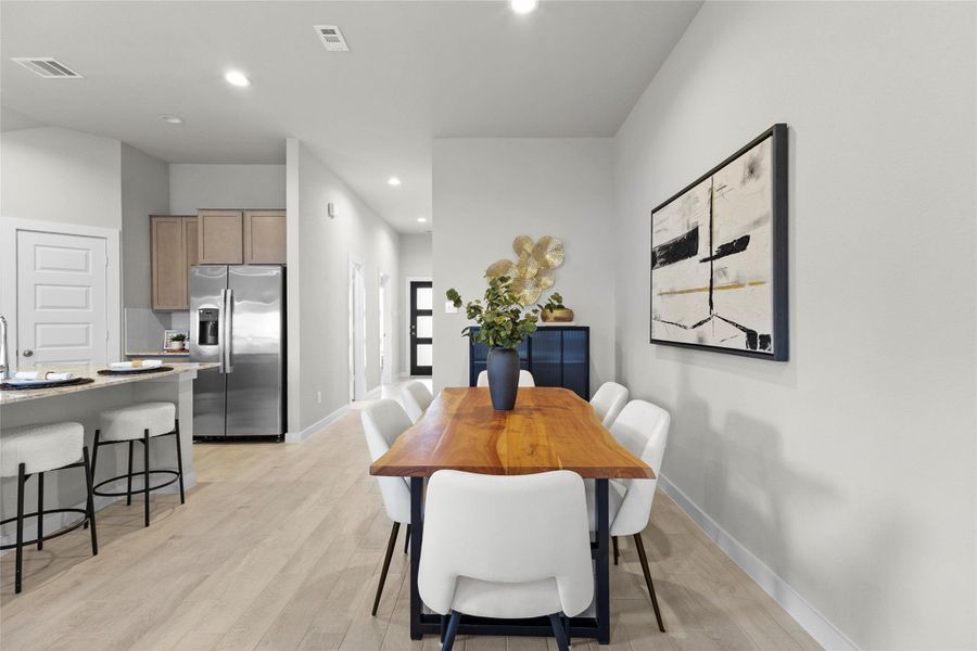 Another view of the dining area highlights its open connection to the kitchen and easy flow throughout the home. Another view of the dining area highlights its open connection to the kitchen and easy flow throughout the home.