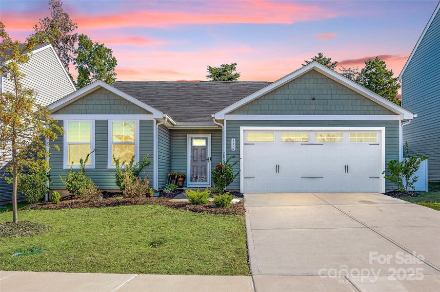 Front exterior of a new home in , Troutman, NC, highlighting curb appeal (Image 1).
