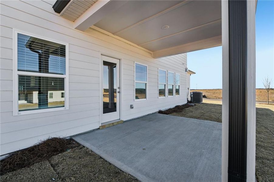 Exterior details and patio area of a home in River Pointe, Monroe (Image 3).