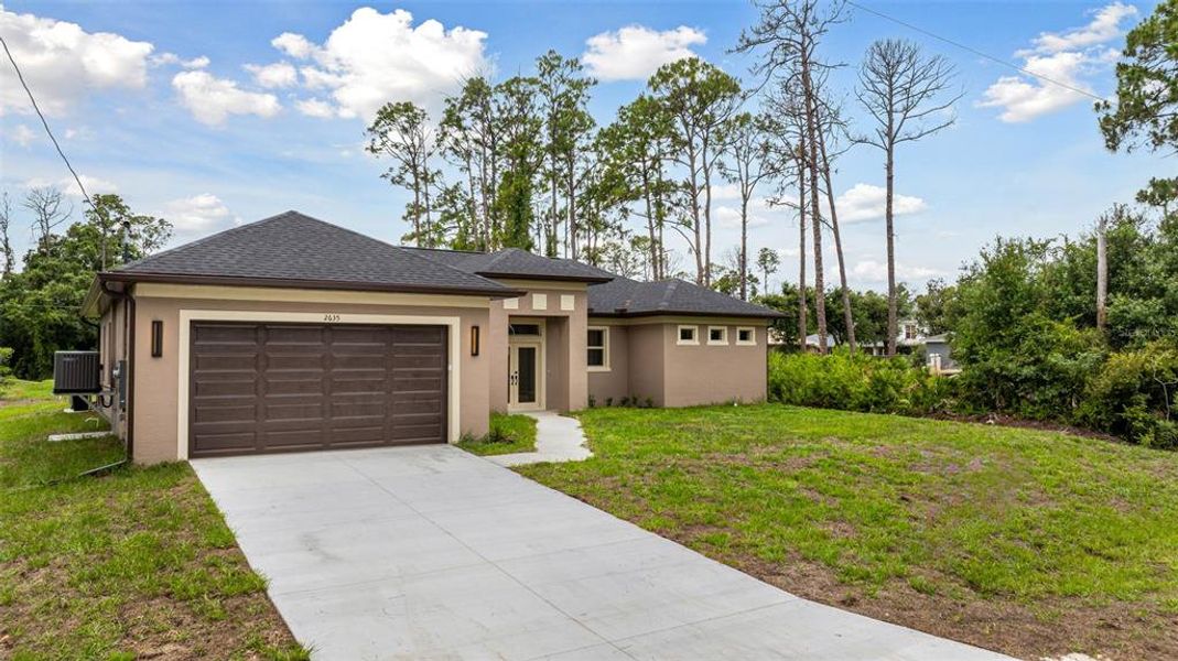 Front exterior of a new home in , North Port, FL, highlighting curb appeal (Image 27). Front exterior of a new home in , North Port, FL, highlighting curb appeal (Image 27).