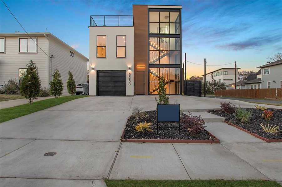 Modern home with a balcony and a garage