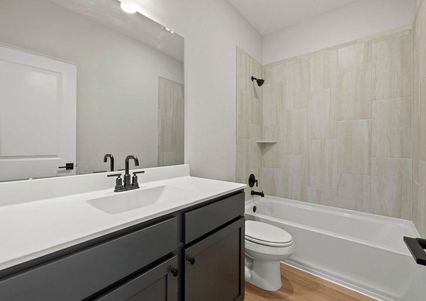 Secondary bathroom with a shower/tub combination
