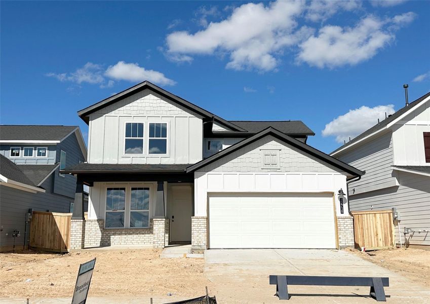 Front exterior of a new home in 45' Traditional Homes at Elyson, Katy, TX, highlighting curb appeal (Image 1). Front exterior of a new home in 45' Traditional Homes at Elyson, Katy, TX, highlighting curb appeal (Image 1).