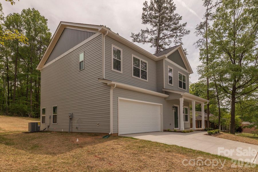 Front exterior of a new home in , Charlotte, NC, highlighting curb appeal (Image 26).