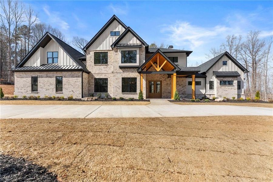 Front exterior of a new home in , Hoschton, GA, highlighting curb appeal (Image 26).