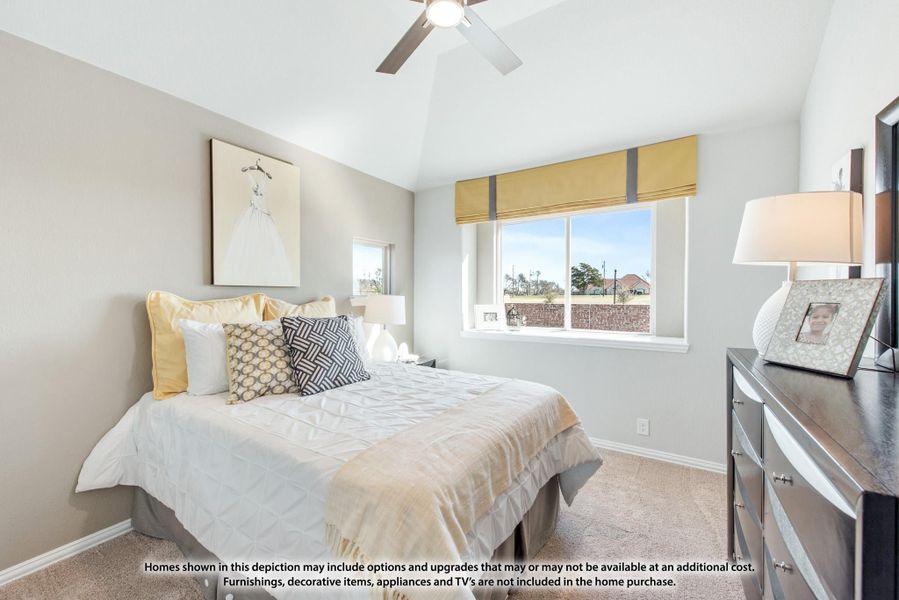 Bedroom with vaulted ceiling, ceiling fan, carpet flooring, and large window with yellow Roman shade Bedroom with vaulted ceiling, ceiling fan, carpet flooring, and large window with yellow Roman shade