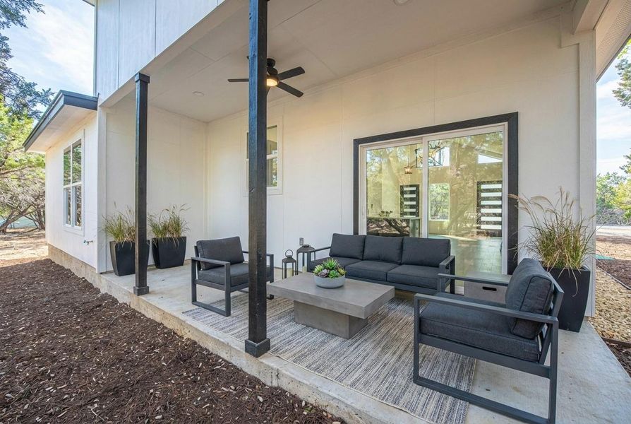 View of patio / terrace with a ceiling fan and an outdoor living space