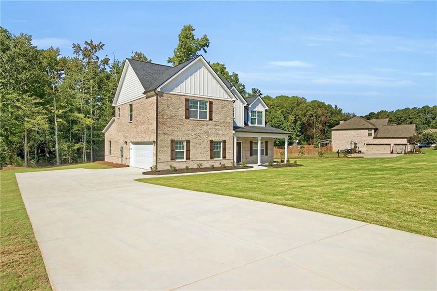 Front exterior of a new home in , McDonough, GA, highlighting curb appeal (Image 23). Front exterior of a new home in , McDonough, GA, highlighting curb appeal (Image 23).