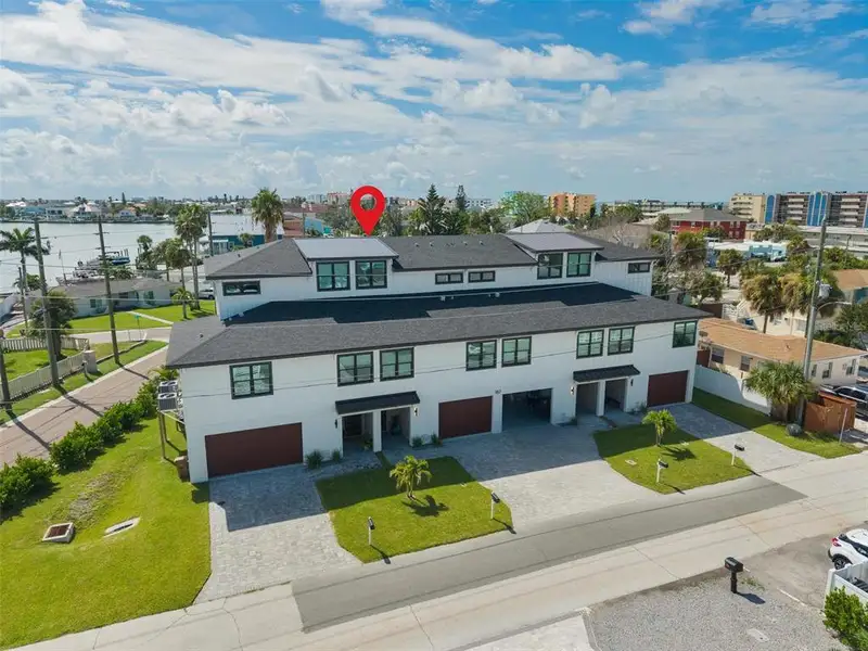 Front exterior of a new home in , Madeira Beach, FL, highlighting curb appeal (Image 26).