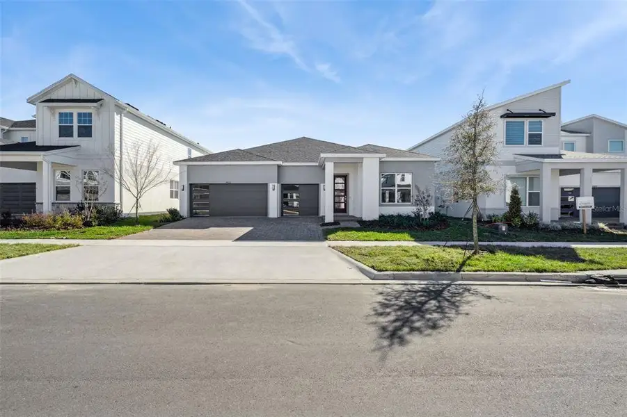 Front exterior of a new home in , Clermont, FL, highlighting curb appeal (Image 20). Front exterior of a new home in , Clermont, FL, highlighting curb appeal (Image 20).
