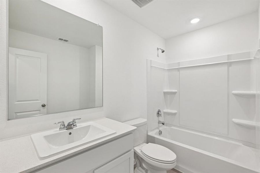 Bathroom featuring vanity and washtub / shower combination Bathroom featuring vanity and washtub / shower combination