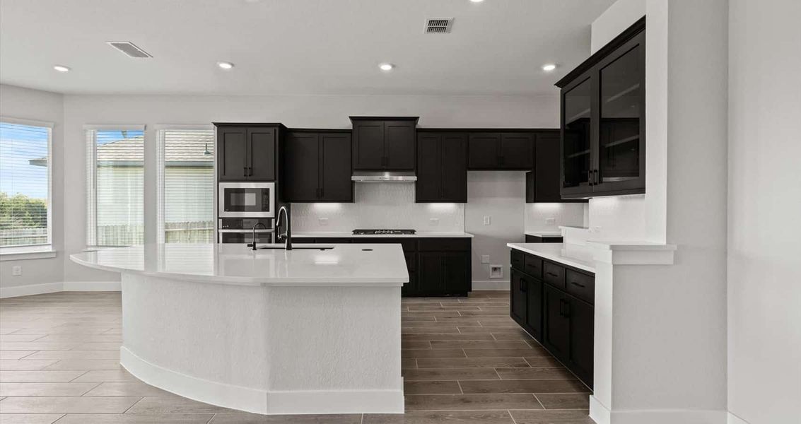 Furnished interior view inside a new home in Village at Three Oaks, Seguin (Image 6).