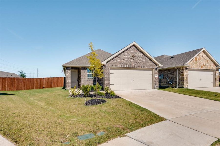 Ranch-style home with brick siding, a shingled roof, concrete driveway, and an attached garage Ranch-style home with brick siding, a shingled roof, concrete driveway, and an attached garage
