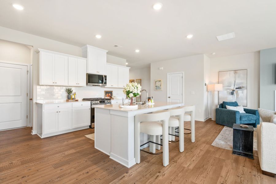 A kitchen with white cabinets. A kitchen with white cabinets.