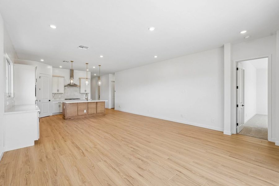 Great room, dining and kitchen Great room, dining and kitchen