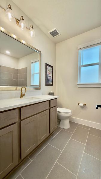 A view of the secondary bath. Tub/shower combo