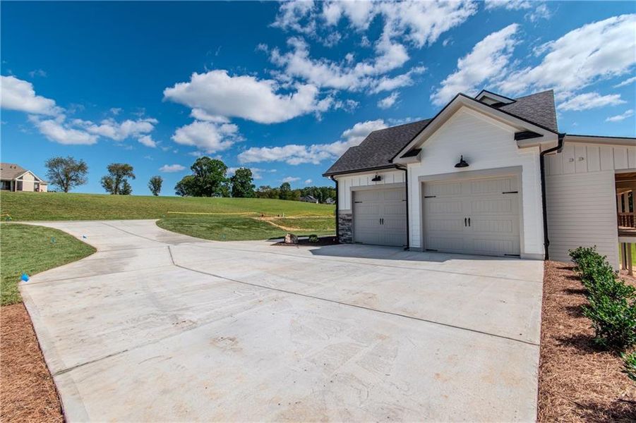 Front exterior of a new home in , Blairsville, GA, highlighting curb appeal (Image 26). Front exterior of a new home in , Blairsville, GA, highlighting curb appeal (Image 26).