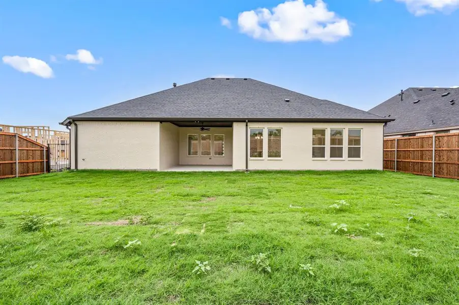 Front exterior of a new home in LeTara, Haslet, TX, highlighting curb appeal (Image 2).