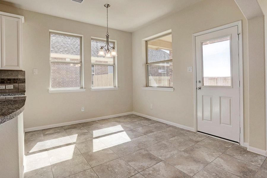 Sun-lit dining area (*Photo not of actual home and used for illustration purposes only.)