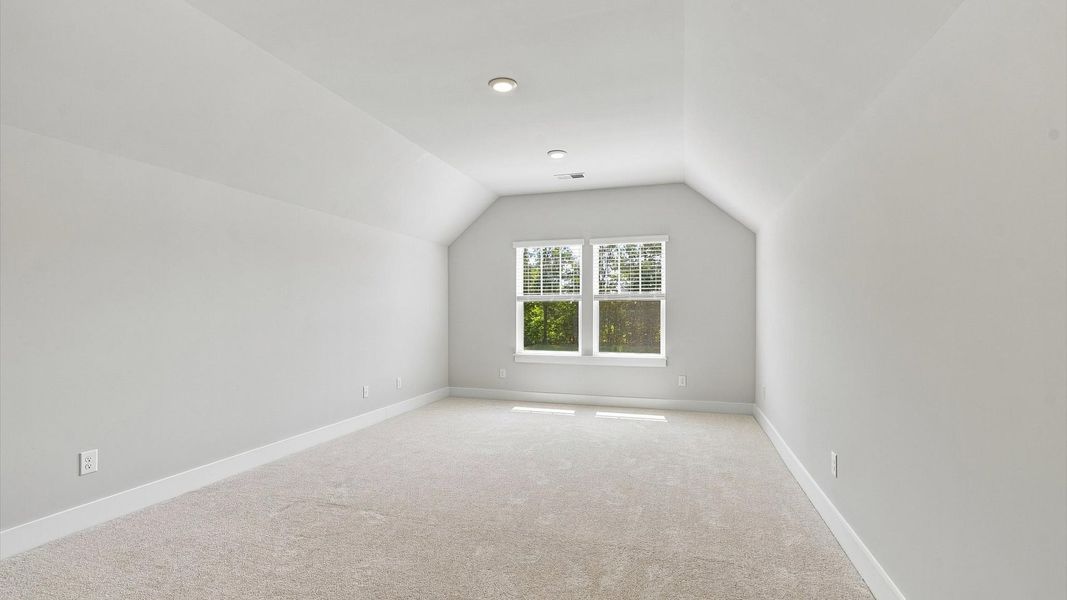 Bright bonus room with flexible space for a media room, home office, or playroom Bright bonus room with flexible space for a media room, home office, or playroom