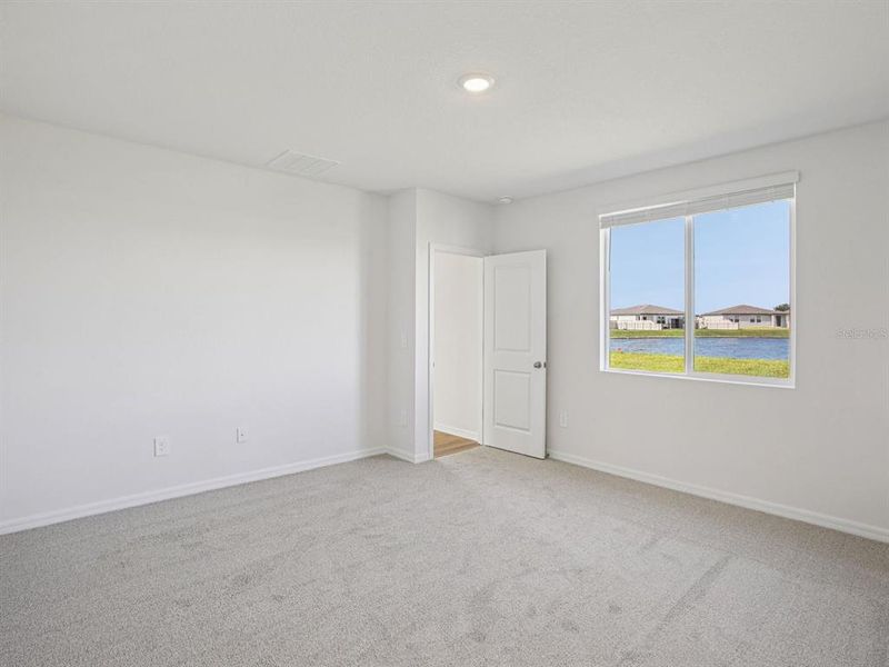 Spacious, unfurnished interior of a new home in The Grove at Stuart Crossing - Classic Series, Bartow (Image 27).